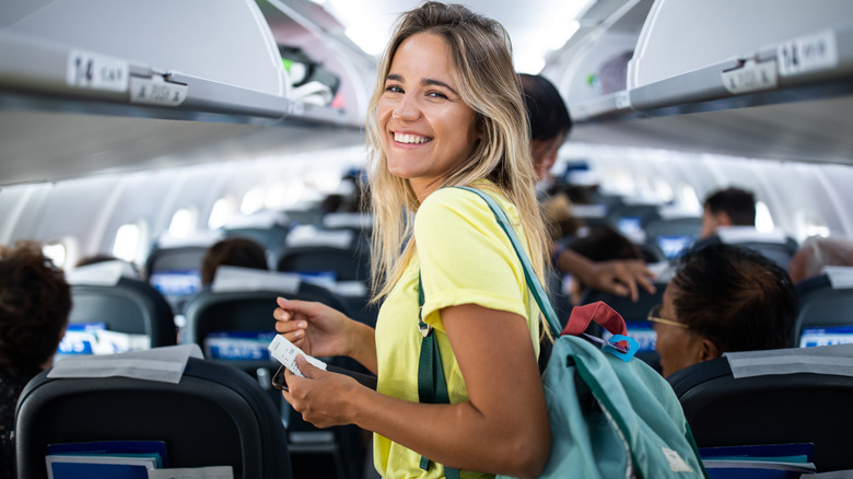 woman smiling on plane