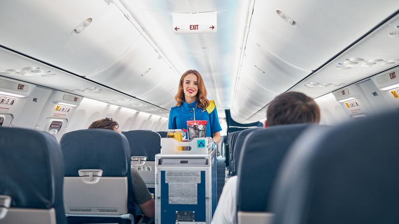 flight attendant with beverage cart