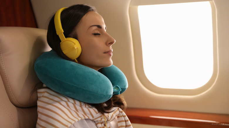 Woman sleeping on a plane