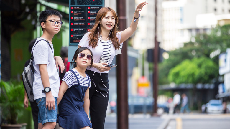 Family hailing a taxi