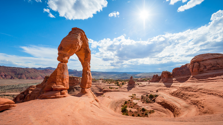 Stone arch in desert landscape